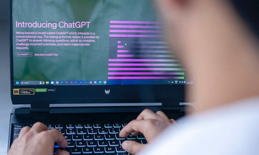 person on laptop using ChatGPT person on laptop using ChatGPT